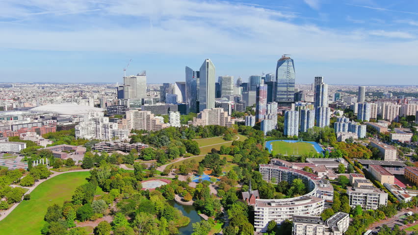 Paris: Aerial view of skyscraper skyline of La Defense, major business district in capital city of France from Parc André Malraux park, sunny day with blue sky—landscape panorama of Europe from above Royalty-Free Stock Footage #1108752515