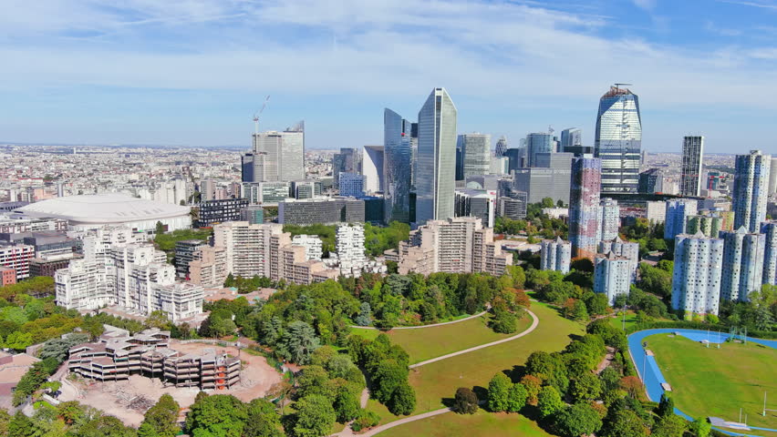 Paris: Aerial view of skyscraper skyline of La Defense, major business district in capital city of France from Parc André Malraux park, sunny day with blue sky—landscape panorama of Europe from above Royalty-Free Stock Footage #1108752517