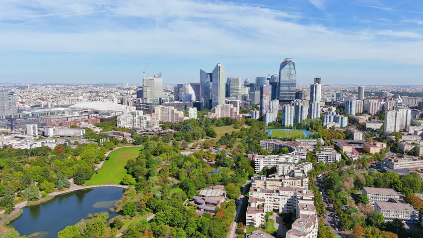 Paris: Aerial view of skyscraper skyline of La Defense, major business district in capital city of France from Parc André Malraux park, sunny day with blue sky—landscape panorama of Europe from above Royalty-Free Stock Footage #1108752523