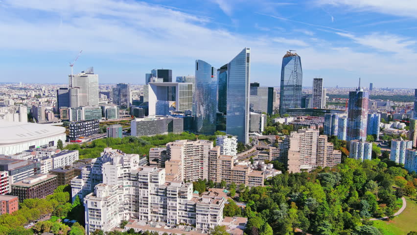 Paris: Aerial view of skyscraper skyline of La Defense, major business district in capital city of France from Parc André Malraux park, sunny day with blue sky—landscape panorama of Europe from above Royalty-Free Stock Footage #1108752527