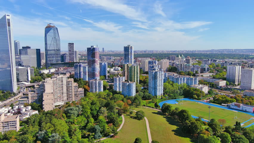 Paris: Aerial view of skyscraper skyline of La Defense, major business district in capital city of France from Parc André Malraux park, sunny day with blue sky—landscape panorama of Europe from above Royalty-Free Stock Footage #1108752529