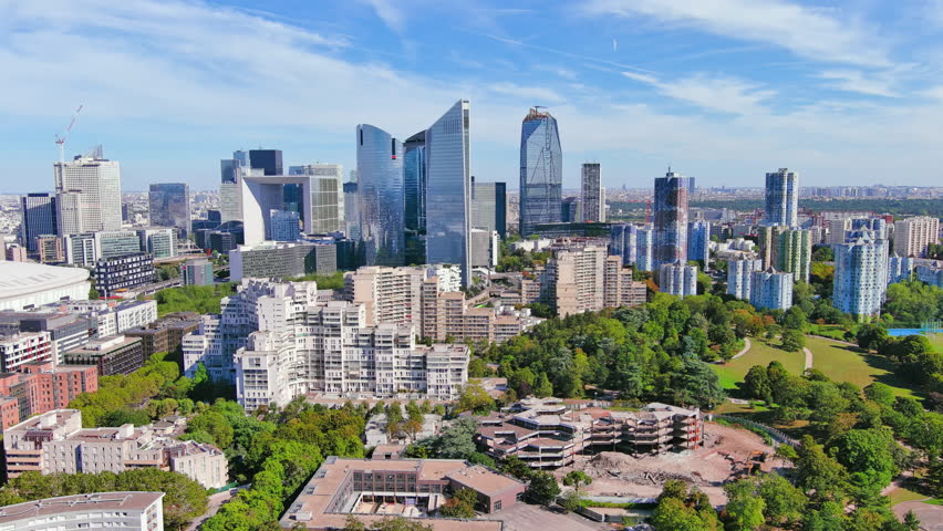 Paris: Aerial view of skyscraper skyline of La Defense, major business district in capital city of France from Parc André Malraux park, sunny day with blue sky—landscape panorama of Europe from above Royalty-Free Stock Footage #1108752533