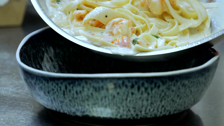 Spicy spaghetti with seafood, fried spaghetti, pasta with shrimp and squid. Pasta with squid and shrimps on a plate, fragrant pasta with sauce | Shutterstock HD Video #1108760067