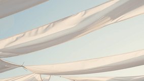 Waving white fabric on sunrise at the ocean beach on sunrise - Powered by Shutterstock - Get 15% off with code: PIKWIZARD15