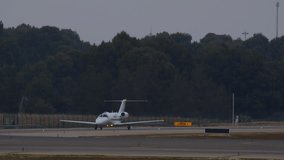 A private jet taxis to the runway at sunset for takeoff from the airport's runway - Powered by Shutterstock - Get 15% off with code: PIKWIZARD15