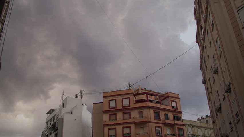 Residential buildings against a gray cloudy sky