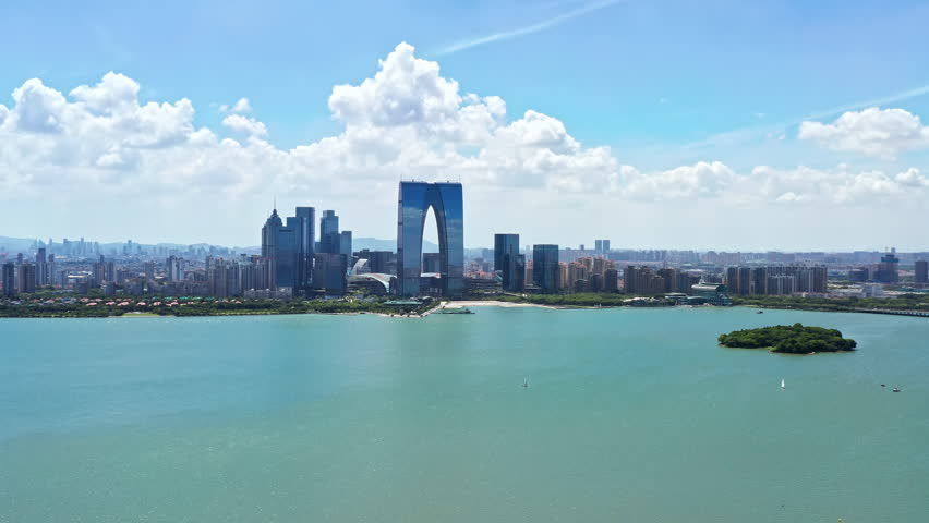 Aerial view of the city skyline and modern buildings by the lake, Suzhou, Jiangsu Province, China.