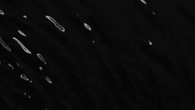 Slow motion water surface texture splash, waves and ripples on black background - Powered by Shutterstock - Get 15% off with code: PIKWIZARD15