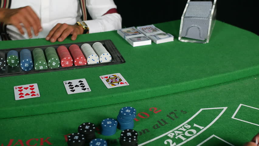 Casino croupier poker dealer dealing an ace card on a black jack table featuring stacks of cash and chips Royalty-Free Stock Footage #1108780661