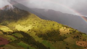 Scenic Aerial View of a Double Rainbow Gracing Hillside and Mountainous Landscape in Ecuador. - Powered by Shutterstock - Get 15% off with code: PIKWIZARD15