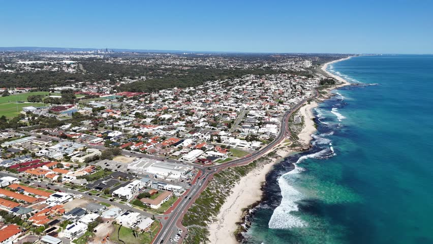 Aerial landscape video above Trigg Beach in Perth, Western Australia with the city in the background. Royalty-Free Stock Footage #1108780925