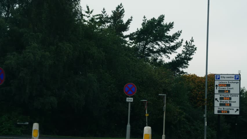 Car journey into Bradford City in Yorkshire slow motion shot selective focus