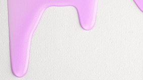 Liquid light purple drops of cosmetics product with bubbles flowing on the white surface. Macro shot of shower gel of lavender color  dripping on the wall with copy space. Close-up. Slow Motion - Powered by Shutterstock - Get 15% off with code: PIKWIZARD15