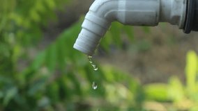 water faucet dripping water with blurred background, water saving concept.  - Powered by Shutterstock - Get 15% off with code: PIKWIZARD15