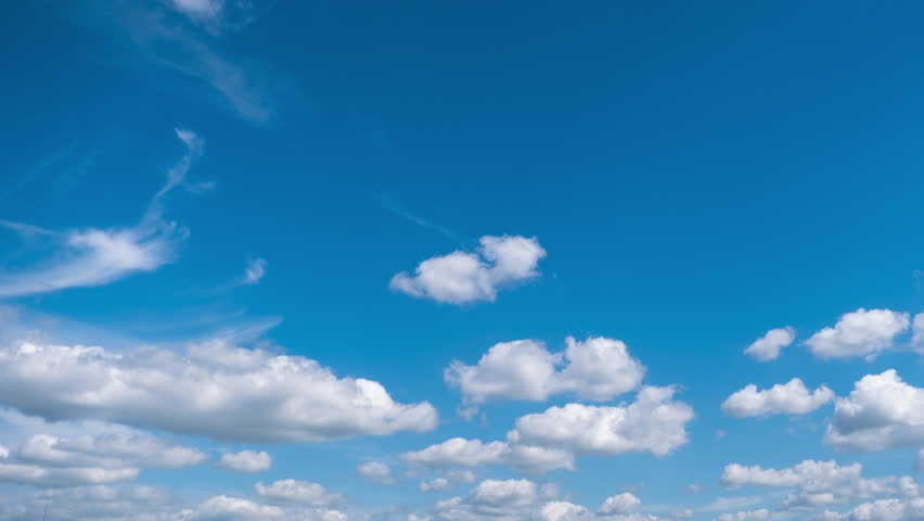 Timelapse of soft white cumulus clouds move in the blue sky. The background of light calm clouds changes shape in cloudy space. Natural background, time-lapse, copy space. 4K Royalty-Free Stock Footage #1108788741