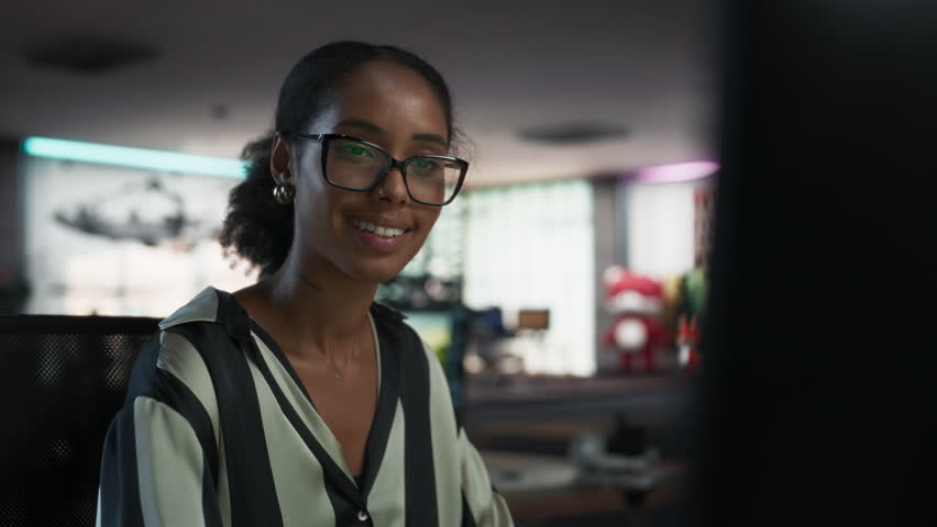 Close Up Portrait of Black Woman Using Desktop Computer, Analysing Data, Thinking and Solving Problems. Female Project Manager Working in Creative Agency, Reviewing Social Media Marketing Strategy.