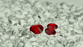 
A group of red diamonds arranged in the pile of a white diamond.
Top view of red ruby diamonds. white gems background video 4K.
Red diamonds in different size.
