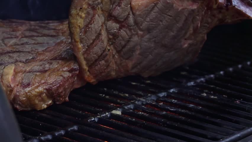 Man with protection glove grilling beef steaks on the grill Royalty-Free Stock Footage #1108801027