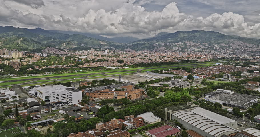 Medellin Colombia Aerial v17 flyover Campo Amor and Santa Fe neighborhoods towards Olaya Herrera Airport capturing San Bernardo cityscape and mountainous views - Shot with Mavic 3 Cine - November 2022