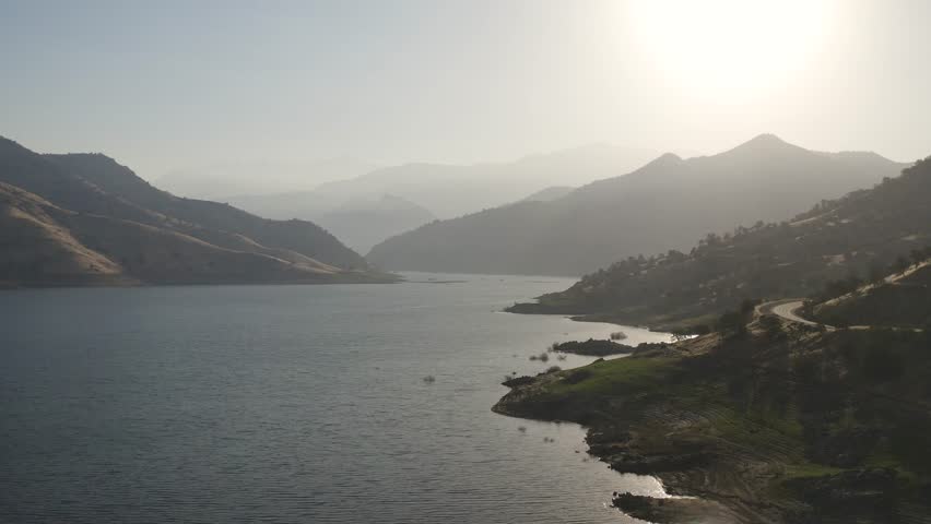 Aerial view of Lake Kaweah and surrounding mountains landscape  in Lemon Cove, California near Sequoia National Park during morning sunrise - 4K Drone