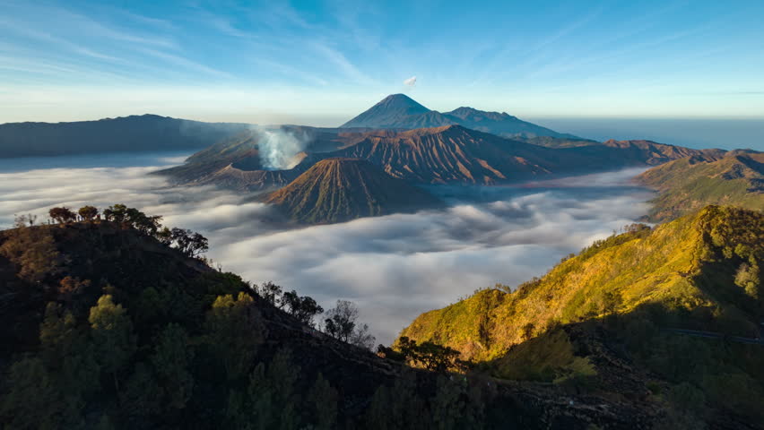 Hyperlapse aerial view flying to mount Bromo active volcano above sea of clouds, Java, Indonesia 
 Royalty-Free Stock Footage #1108805535