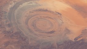 Aerial view of The Eye of Sahara. Satellite view of Sahara Desert. Elements of this video furnished by NASA.