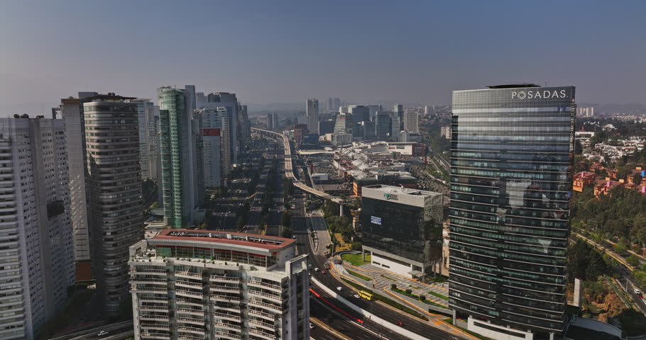 Mexico City Aerial v68 low level flyover mexican federal highway 15D at santa fe, capturing rows of high rise buildings, towers and urban cityscape - Shot with Mavic 3 Cine - January 2022