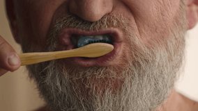 Close up unrecognizable old male retired middle-aged senior mature elderly man cropped view mouth brushing teeth toothbrush and toothpaste morning hygiene procedure oral anti cavity tooth care dental - Powered by Shutterstock - Get 15% off with code: PIKWIZARD15