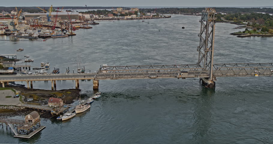 Portsmouth New Hampshire Aerial v16 fly around bridge with traffic crossing piscataqua river, capturing downtown cityscape at sunset golden hours - Shot with Inspire 2, X7 camera - October 2021
