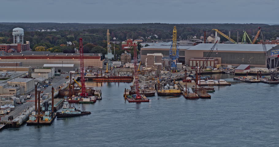 Portsmouth New Hampshire Aerial v17 fly around navel shipyard at kittery maine along piscataqua river with cranes, seavey island, barge and warehouse - Shot with Inspire 2, X7 camera - October 2021