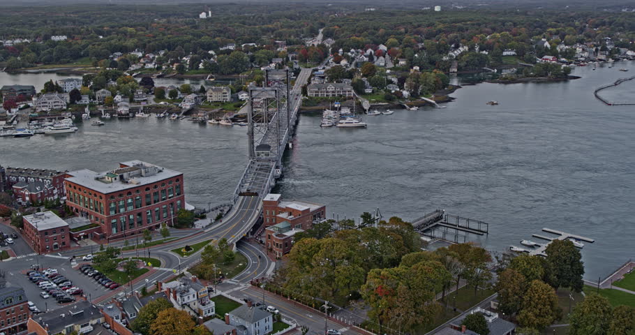Portsmouth New Hampshire Aerial v14 cinematic flyover and around prescoot park and world war i memorial bridge with commuters crossing river at sunset - Shot with Inspire 2, X7 camera - October 2021