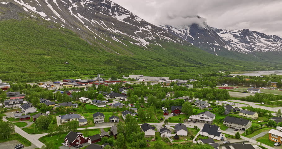 Nordkjosbotn Norway Aerial v2 cinematic flyover small village town capturing residential neighborhood surrounded by mountain valley overlooking at inlet fjord - Shot with Mavic 3 Cine - June 2022