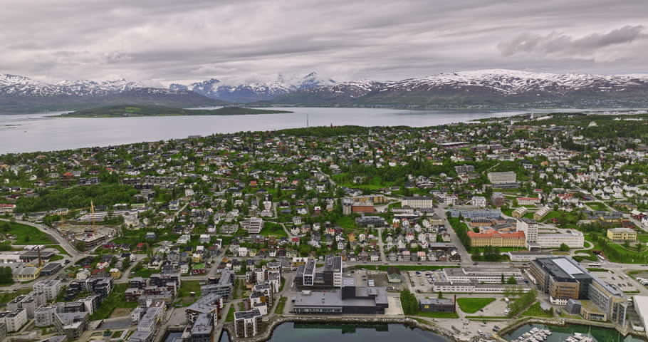 Tromsø Norway Aerial v5 flyover downtown across residential neighborhoods of Elverhøy, Stalheim and Forhåpningen overlooking at mountainous landscape - Shot with Mavic 3 Cine - June 2022