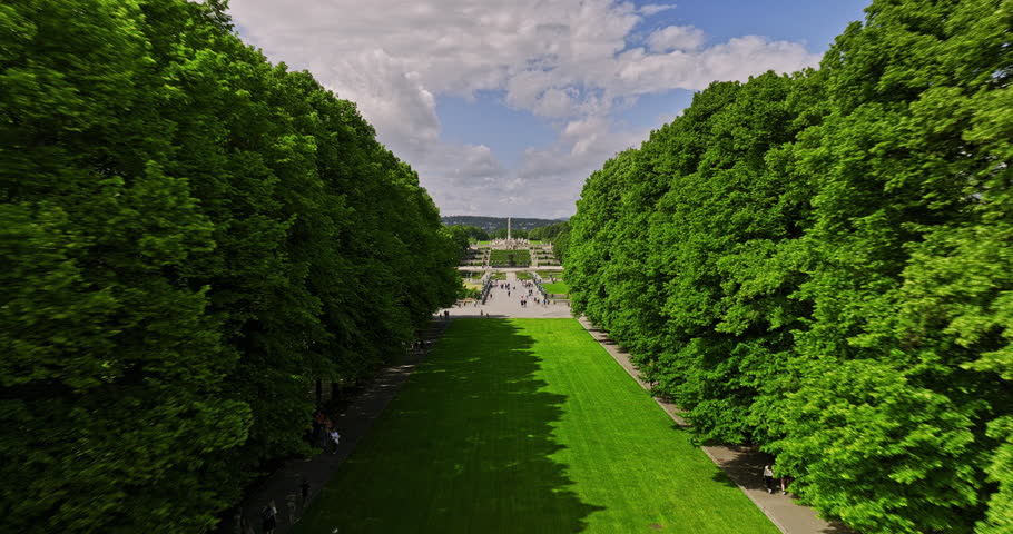 Oslo Norway Aerial v47 low level flying straight above Frogner Park capturing artistic sculptures, flyover reveals Montebello residential neighborhood in summer - Shot with Mavic 3 Cine - June 2022