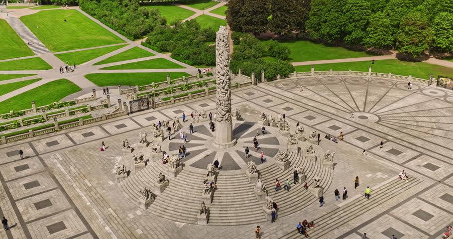 Oslo Norway Aerial v44 cinematic low level birds eye view fly around the remarkable centerpiece Monolitten Sculpture with tourists visiting famous Frogner Park - Shot with Mavic 3 Cine - June 2022