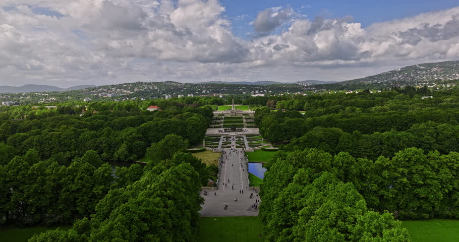 Oslo Norway Aerial v43 establishing low level drone flyover Frogner Park along the pathway with Smestad and Montebello neighborhoods landscape view on a sunny day - Shot with Mavic 3 Cine - June 2022 Royalty-Free Stock Footage #1108808999