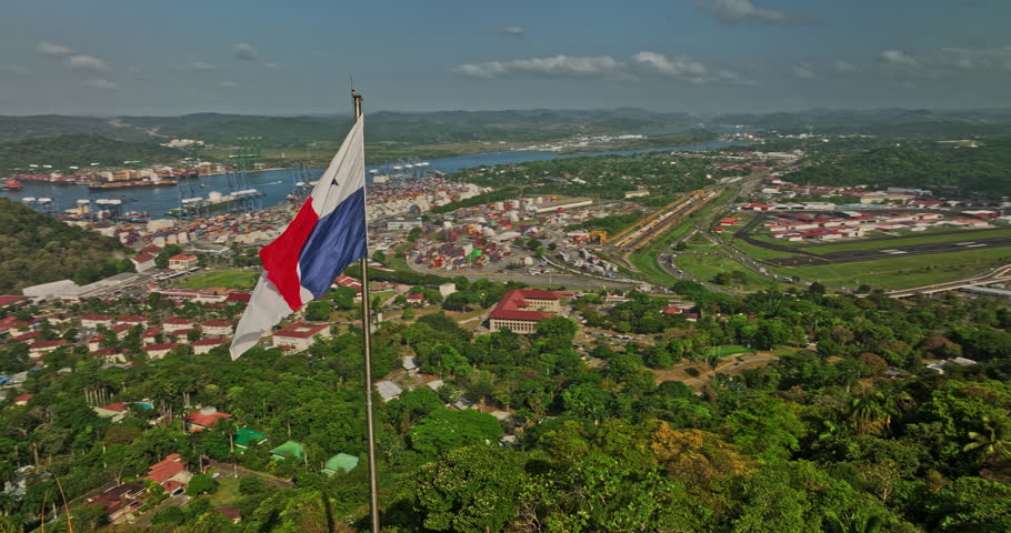 Panama City Aerial v65 panoramic view fly around national flag on ancon hill capturing port of balboa shipyard canal, historic district and downtown cityscape - Shot with Mavic 3 Cine - March 2022 Royalty-Free Stock Footage #1108809109