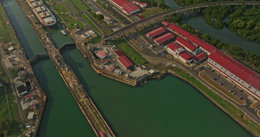 Panama City Aerial v42 industrial establishing shot birds eye view capturing commercial cargo ships at miraflores locks transiting through the water canal - Shot with Mavic 3 Cine - March 2022 Royalty-Free Stock Footage #1108809161