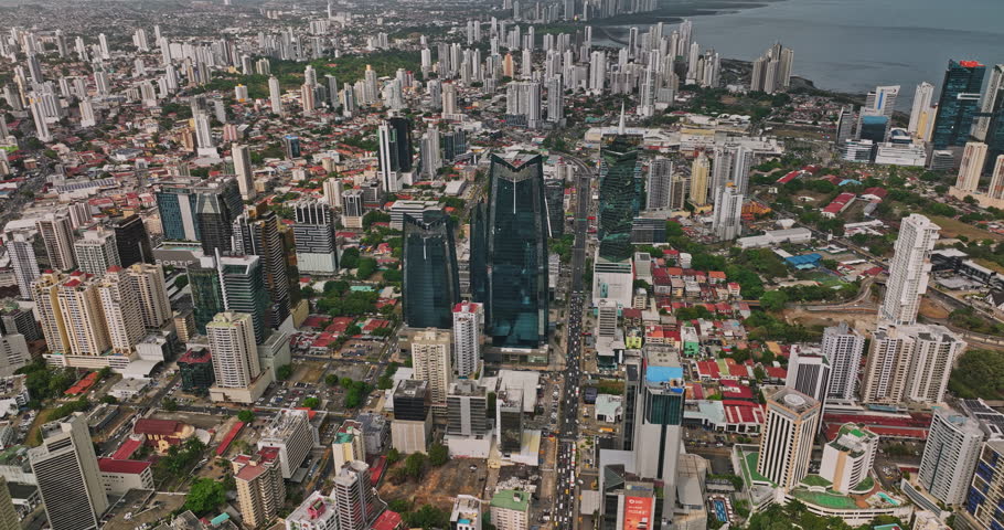 Panama City Aerial v20 birds eye view reverse flyover along calle 50 capturing busy street traffic and populous downtown cityscape across campo alegre and obarrio - Shot with Mavic 3 Cine - March 2022