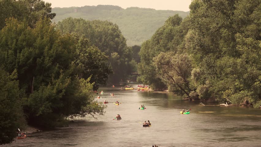 floating kayaks on montain river. Perigord, France