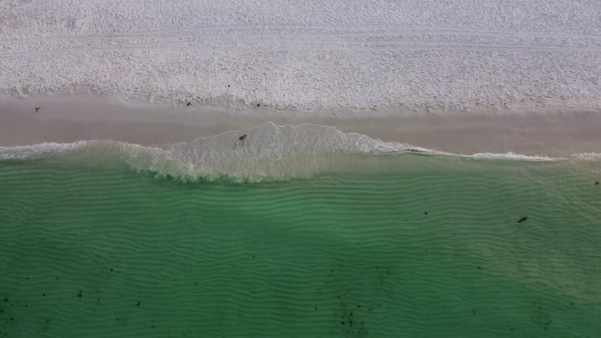 Okaloosa Island with an empty Beach during morning in Destin Fort Walton Beach, Florida. Aerial view of beach shore okaloosa island Gulf of Mexico. Doris Jordan Freeway Beachwalk sunrise view.