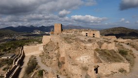 view from a drone of the ancient city of Sagunto, also of the Arciprestal Church, Sagunto Castle, Roman Theater of Sagunto, Valencian Countryside sanset panorama flyby location traditional houses