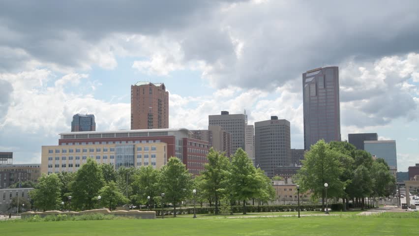 St. Paul, Minnesota.  Daytime panned view of the city skyline with trees.  