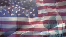 Animation of waving usa flag against team of diverse surgeons performing operation at hospital. Medical healthcare and patriotism concept - Powered by Shutterstock - Get 15% off with code: PIKWIZARD15