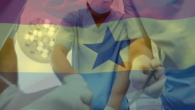 Animation of waving ghana flag against team of diverse surgeons performing operation at hospital. Global medical healthcare concept - Powered by Shutterstock - Get 15% off with code: PIKWIZARD15