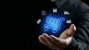 Businessman holding virtual info graphics with trolley cart and shopping, business, finance icons, Technology online shopping business concept. E commerce, E payment, make payment online transaction. - Powered by Shutterstock - Get 15% off with code: PIKWIZARD15