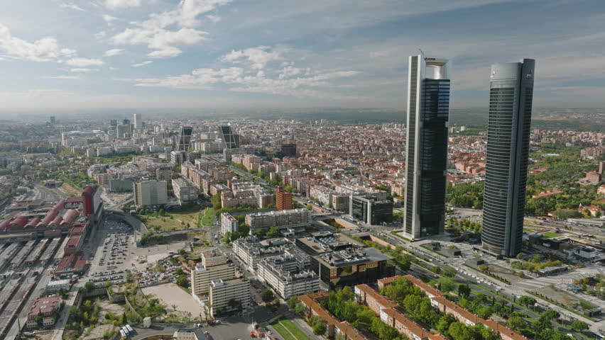 The aerial panorama of Madrid's financial district is a symphony of modern design and commerce.
 Royalty-Free Stock Footage #1108853853