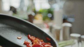 Close-up view of tossing vegetables in a frying pan while cooking food in the kitchen. No people shot - Powered by Shutterstock - Get 15% off with code: PIKWIZARD15