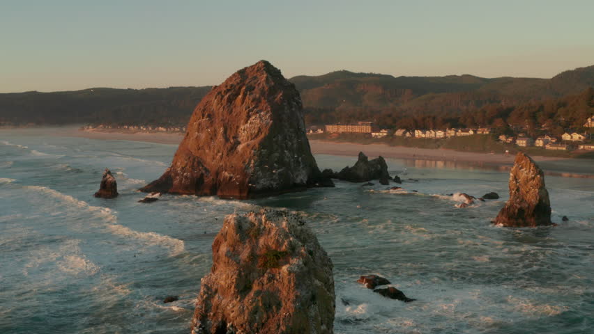 Rising aerial shot of Haystack rock and Cannon beach Royalty-Free Stock Footage #1108855399