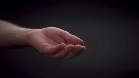 Open caucasian hand isolated on black background, gesture of helping hand - Powered by Shutterstock - Get 15% off with code: PIKWIZARD15